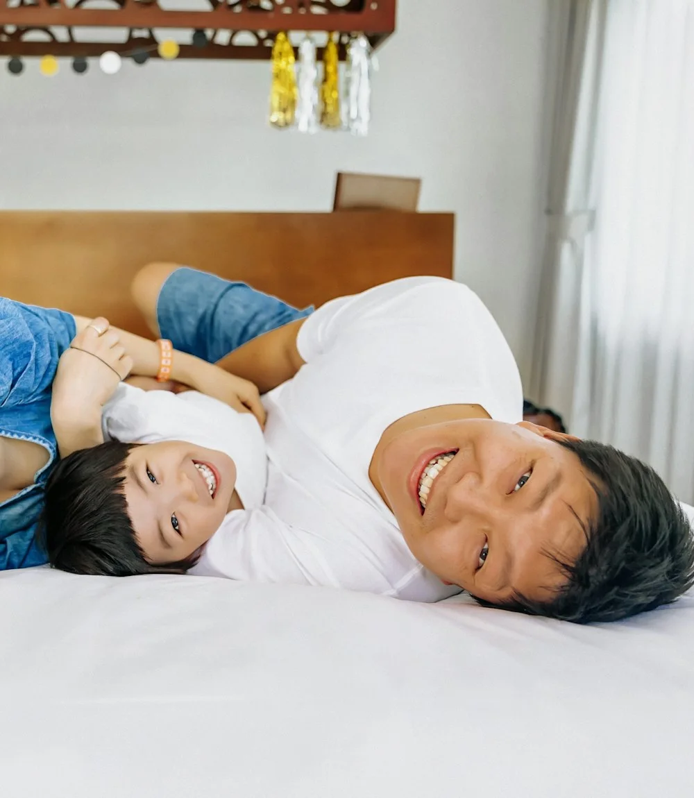 His family laughing together at home in Manila