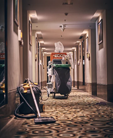 Rosa's housekeeping cart in a hotel corridor