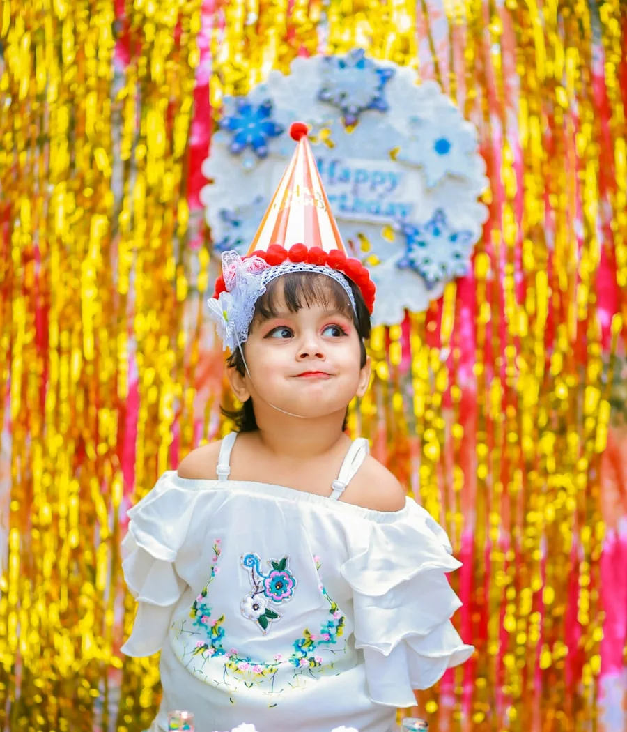 His daughter in front of her birthday cake in Hanoi