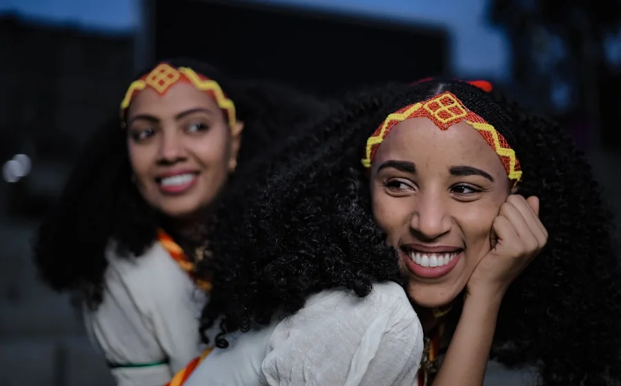 His sisters laughing at a celebration in Addis Ababa
