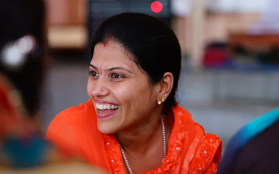 An Indian saleswoman in Sharjah smiling
